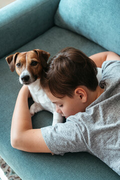 Kid sleeping together with pet.