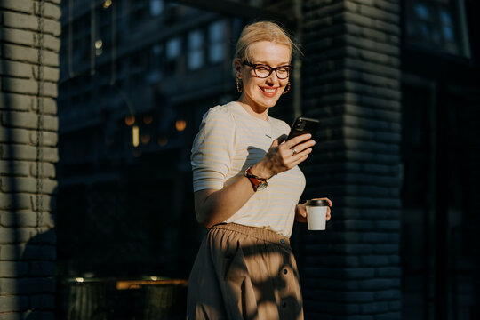 Woman Using Phone in Public