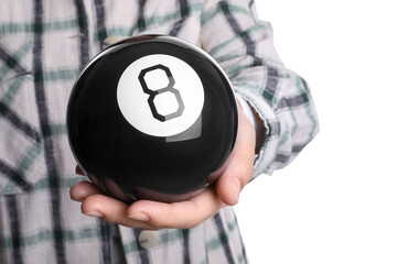 Woman holding magic eight ball on white background, closeup