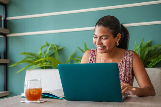 Smiling Businesswoman Working in a Restaurant - Powered by Adobe