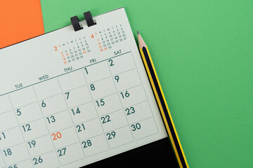 close up of calendar on the colorful table background, planning for business meeting or travel...