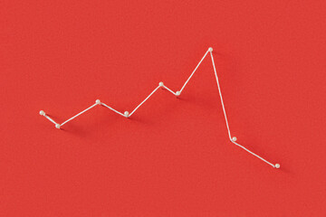 Stationery pins connected with white thread on red paper background