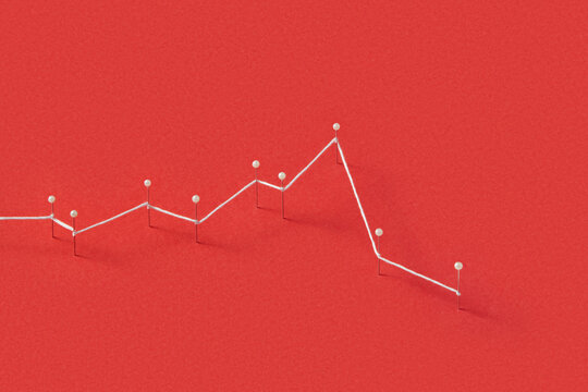 White string connecting straight pins on red paper background