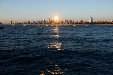 Melbourne cityscape with sun reflection