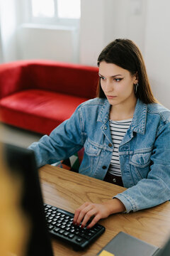 Young female generation z working in office 