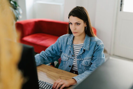 Young female generation z working in office 