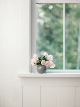 Blush pink roses in a blue vase