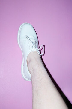 Woman with shin hair wearing shoes. Image normalizing female body hair