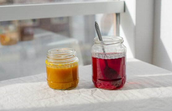 two jars of natural dyes for eggs