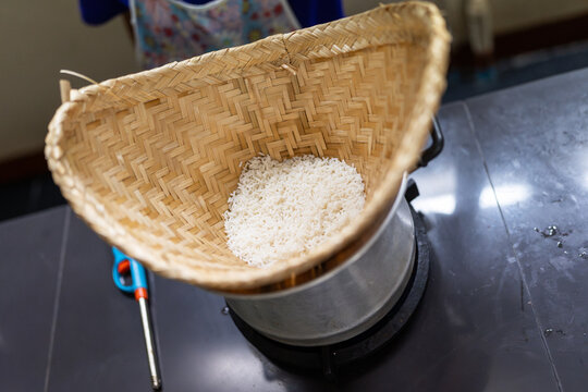 Cook rice with pot and rice steamer.