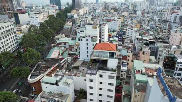 Aerial view of urban cityscape with buildings and trees of Ho Chi Minh City bui vien street Vietnam