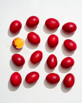 Red Easter Eggs and One Cracked Open, Isolated on White