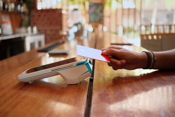 cashless transaction with contactless credit card and  pos terminal