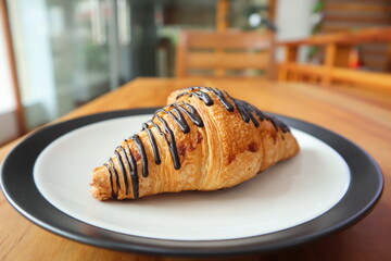 Chocomalt Croissant On table background	
