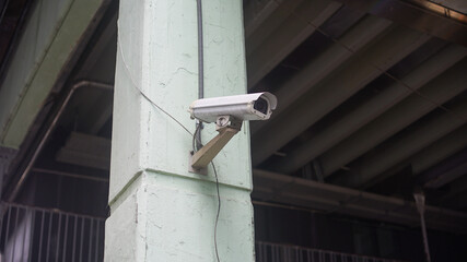 CCTV Camera installed on the white cement pillar