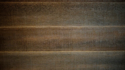 Rough and aged hardwood background with a dark brown gradient. For backdrops, banners, frames,...