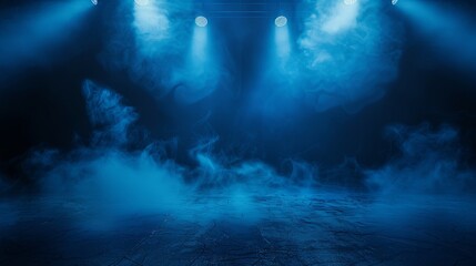 Blue spotlights illuminate the empty stage.