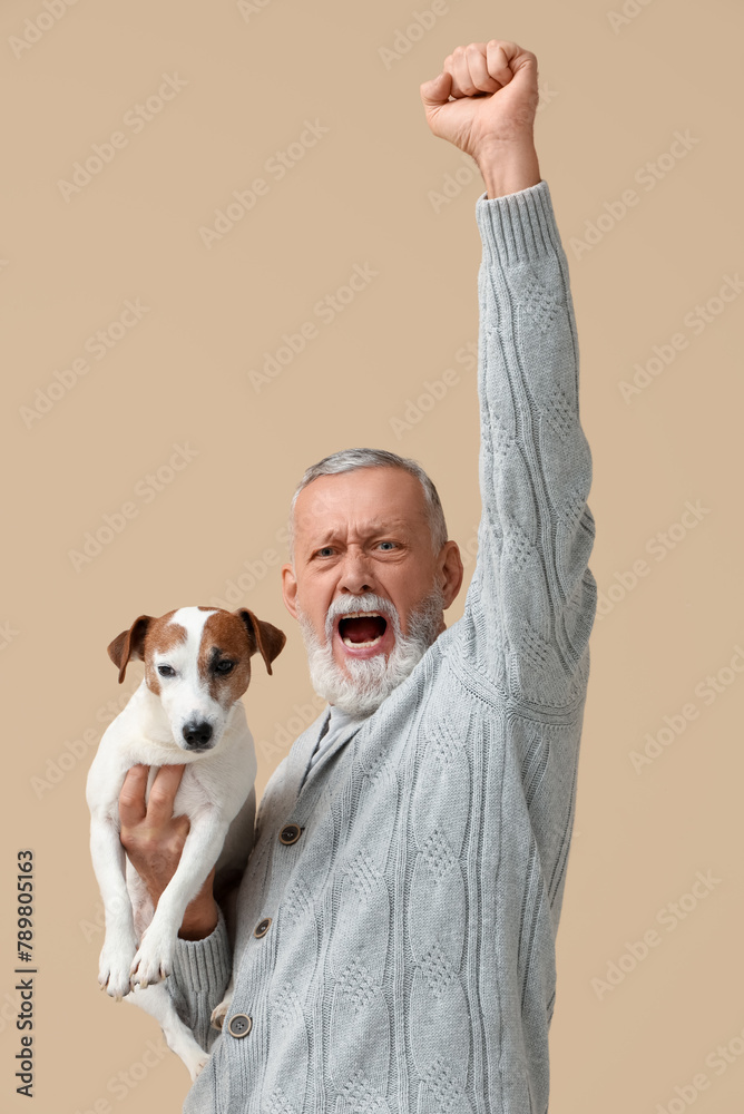 Sticker Happy senior man with cute dog on beige background