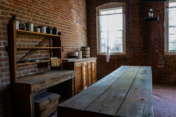 Wooden Table and Vintage Food Containers in The Kitchen at Fort Clinch, Fort Clinch State Park, Amelia Island, Florida, USA