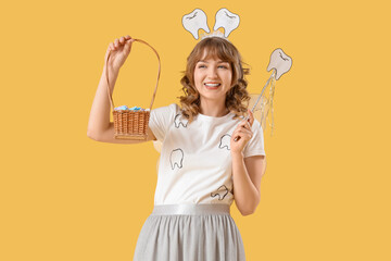 Tooth Fairy with wand and basket on yellow background