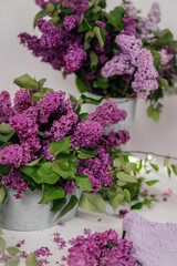 A beautiful composition of lilac bouquets on a light background, creating a soft and elegant atmosphere