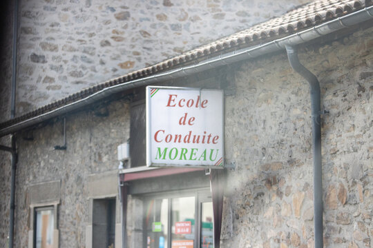 France, 30 March 2024: Driving School Sign on Stone Building Facade.