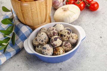 Raw quail eggs in the bowl