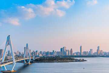 Fototapeta premium High View Scenery of Haikou Century Bridge and International Trade Architecture in Hainan, China
