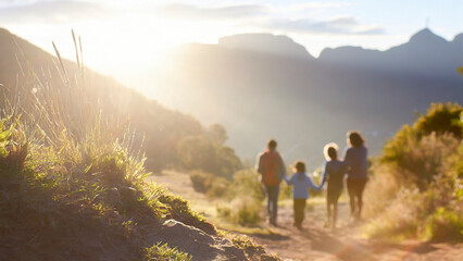 Obraz premium family hiking in the mountains at sunset