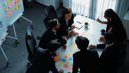 Top view of smart executive manager discuss and choose marketing idea from sticky notes. Group of...