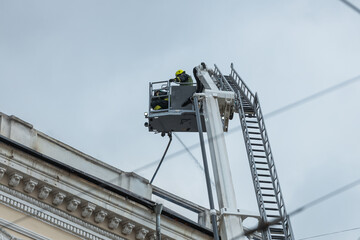 Rescuers are putting out the fire. A damaged residential building after a massive rocket attack....