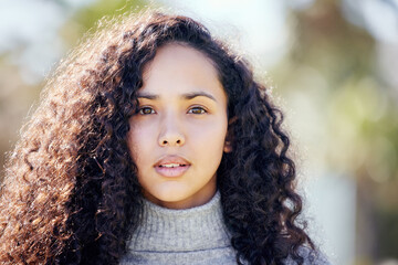 Nature, serious and portrait of woman in park for adventure, sunshine travel and peace on holiday....