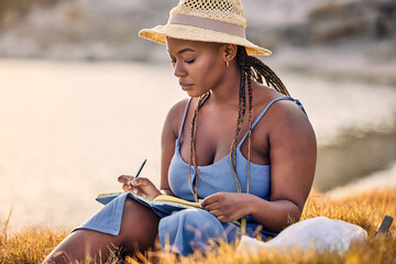 Sunset, notebook and black woman journaling in nature to relax on vacation, adventure or holiday....