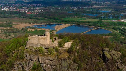 Fototapeta na wymiar Medieval Chojnik Castle atop Karkonosze mountain in aerial shot.