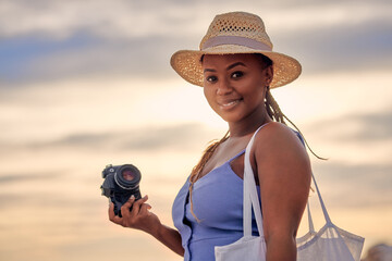 Photographer, sunset or portrait of black woman with camera on holiday vacation or break in Greece. Tourist, girl or African person with smile or sky at nature for picture, photography and travel