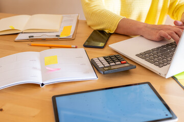 Person Consulting Documents on Laptop, Purchase or Rental Contract, Housing Financing Products, Supply Contracts, Community Receipts, Invoices, Home Insurance Policy