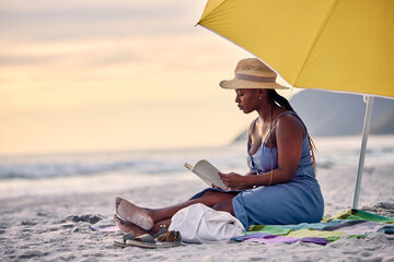 Sunset, relax or black woman reading book at sea for alone time, rest break or holiday vacation. Beach, travel or African person with fiction story or novel for knowledge, peace or hobby in Greece