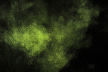Abstract smoke texture. Light green powder explosion on black background. Citron color cloud. Lime dust explode. Freeze motion paint.	
