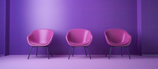 Three chairs lined up against a purple wall