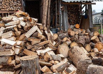wood piles in the yard, wood processing for the winter season, wood heating in the countryside