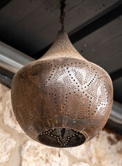 Bronze hanging dining lights combination with cool grey background