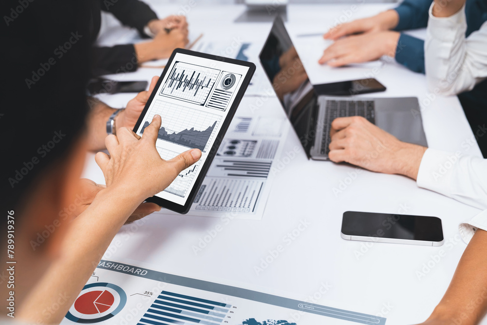 Poster Analyst team uses BI Fintech display tablet to analyze financial data . Business people analyze BI software technology dashboard power for insights power into business marketing planning. Prudent