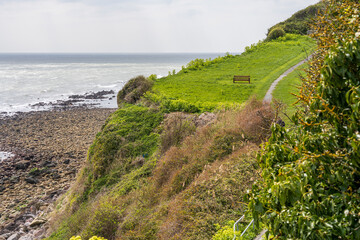 A bench overlooking the Channel coast near Castle Cove, Isle of Wight, UK