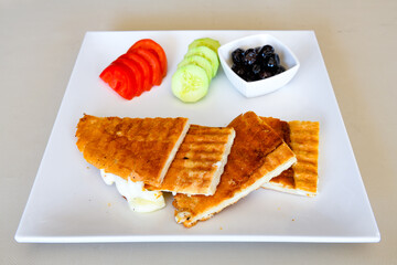 Turkish karisik atom Ayvalik tost ( kasarli bazlama tost) . Sucuklu, Kasarli, kavurmali karisik...