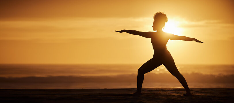 Yoga, sunset and silhouette of woman in warrior pose for exercise, fitness or meditate at beach on mockup. Virabhadrasana, ocean and girl in nature for stretching, wellness and healthy body in summer