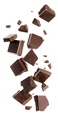 Pieces of dark chocolate falling close up on a white background