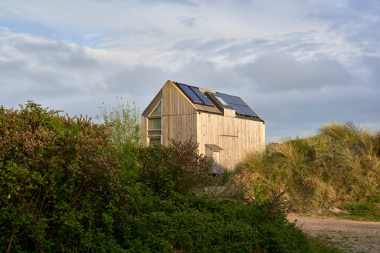 Environmentally friendly eco house with solar cells and photovoltaic. Sustainable vacation home in nature. Holland, Zeeland.