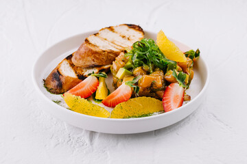 Fresh fruit salad with grilled bread slices