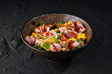 Delectable bacon tataki salad in rustic bowl