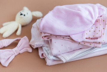 Stack of Baby bodysuits.